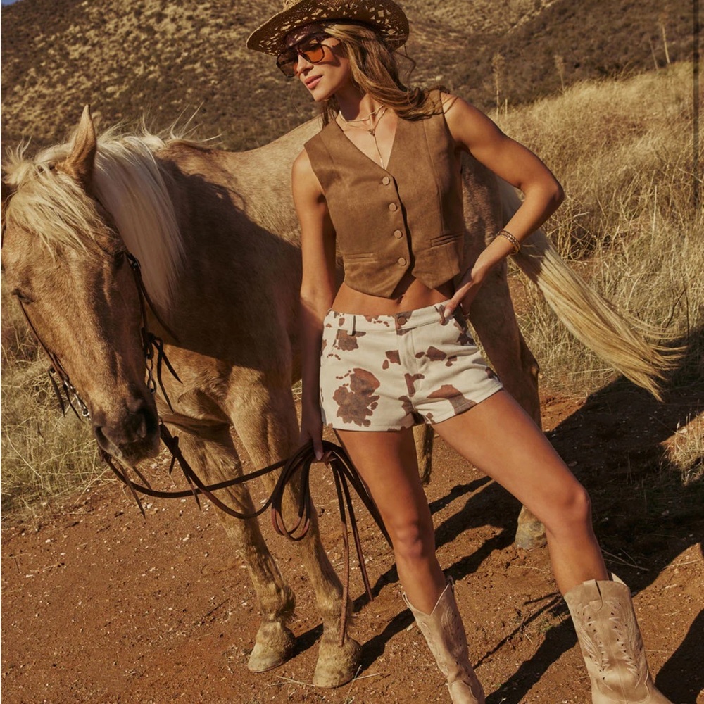 Perfect for Stagecoach!! Mid-rise faux suede cow print shorts